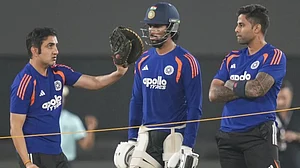 Gautam Gambhir talks strategy with skipper Suryakumar Yadav and Tilak Varma.