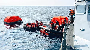 Sailors being rescused from the sunken Iranian vessel IRIS Dena