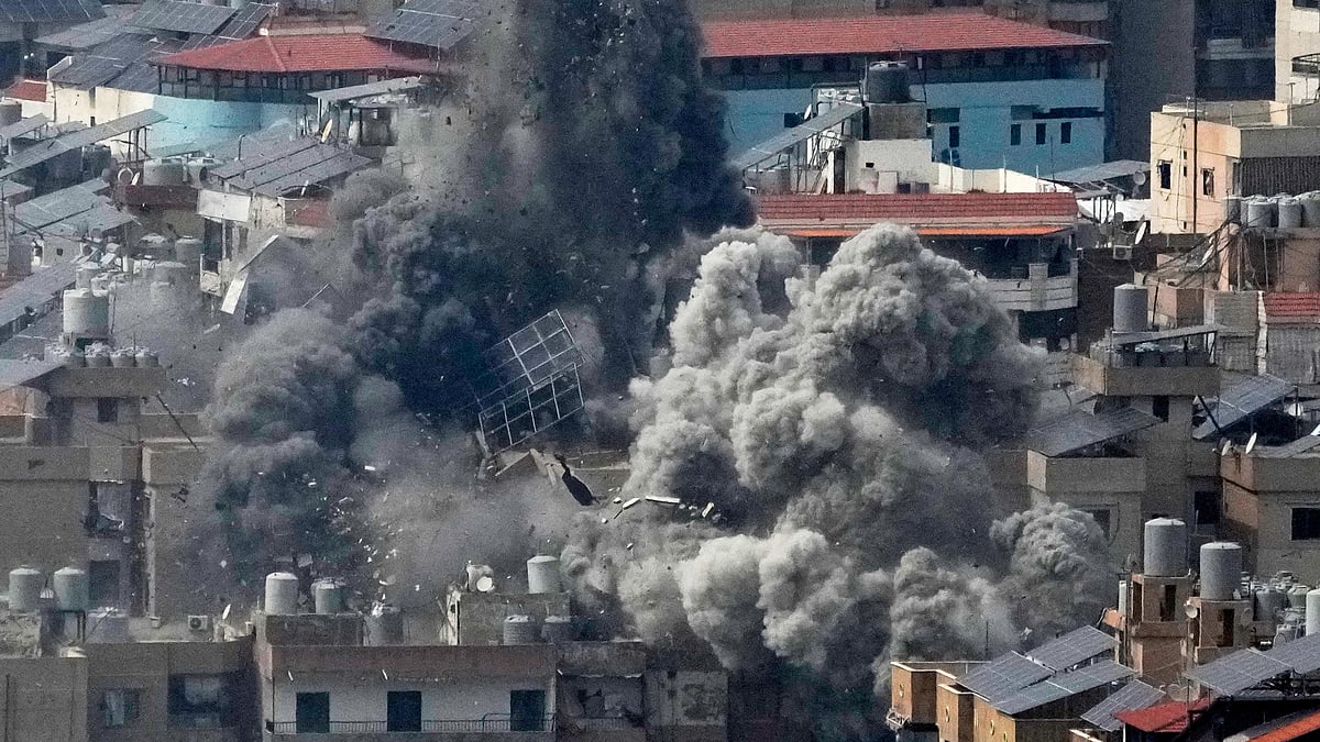 Smoke rises following an Israeli airstrike in Dahiyeh, Beirut's southern suburbs.