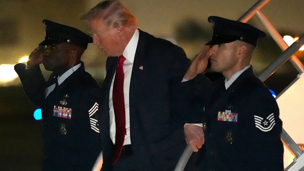 Donald Trump steps off Air Force One at Miami International Airport.