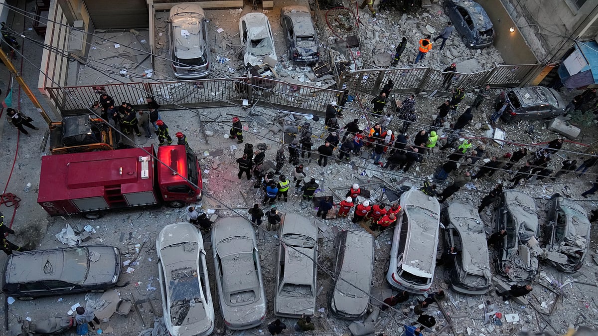 Rescue workers gather at the site where Israeli airstrikes hit apartments in Beirut, Lebanon.