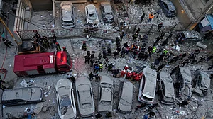 Rescue workers gather at the site where Israeli airstrikes hit apartments in Beirut, Lebanon.