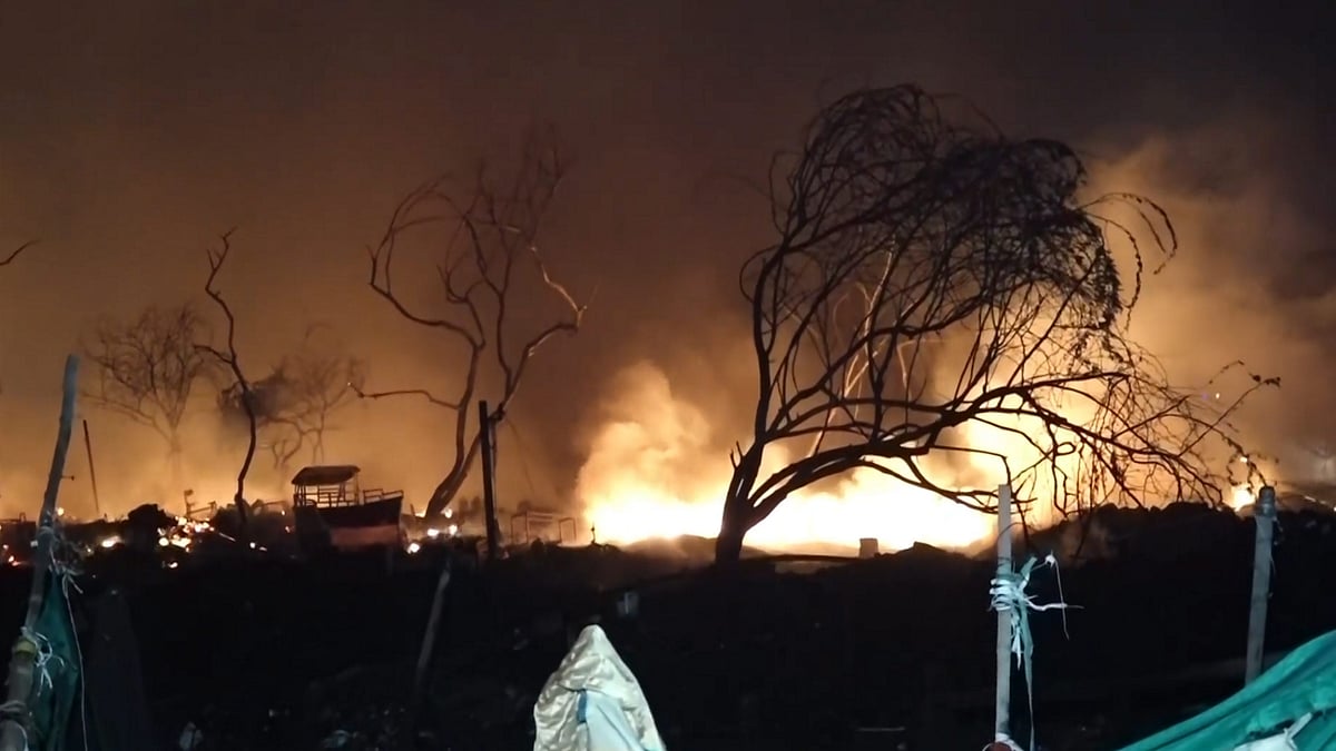 Smoke and flames rise from a fire near fish market in Matiala village, Uttam Nagar, New Delhi.