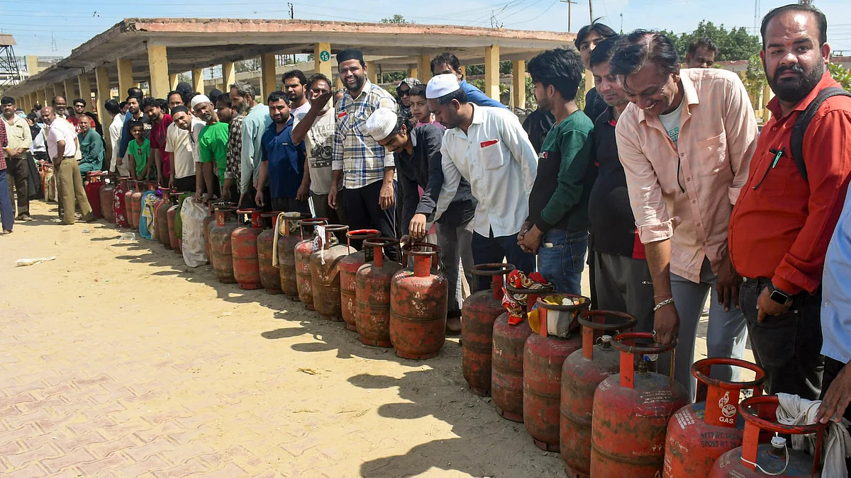 People wait in queue at a gas agency in Meerut, 15 March