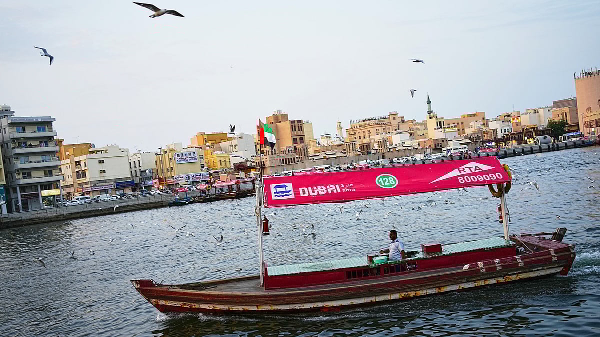 An empty tourist boat in Dubai Creek next to Al Seef market, one of Dubai's busiest tourist areas, 13 Mar