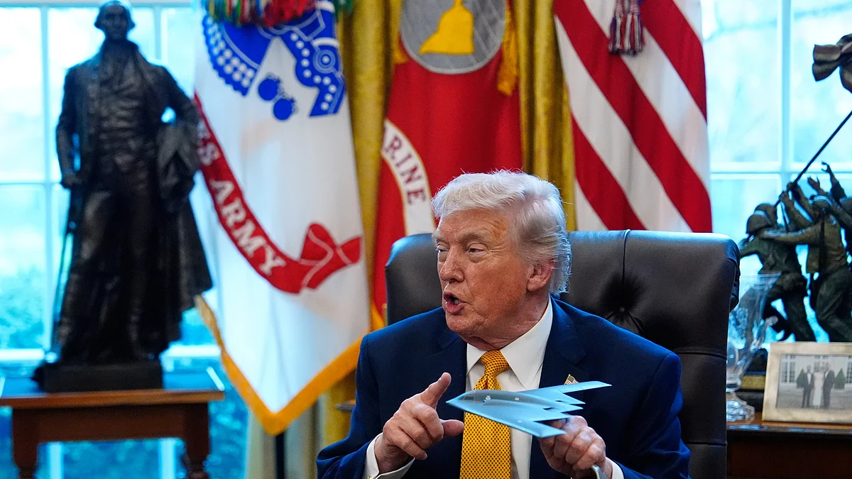 Donald Trump wields a B-2 model at Oval Office.
