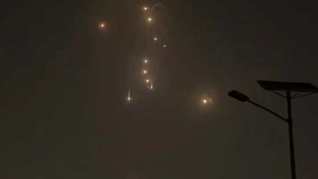 Dubai’s urban skyline lit by incoming missile fire.