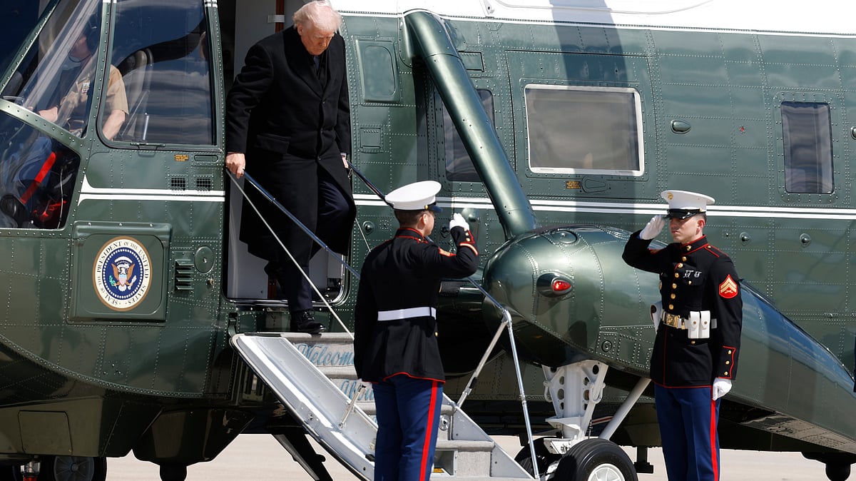 Donald Trump steps off Marine One at Joint Base Andrews before boarding Air Force One.