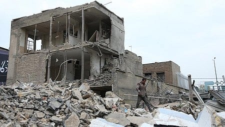 Buildings lie damaged following US-Israel strikes in Iran.