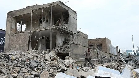Buildings lie damaged following US-Israel strikes in Iran.