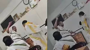 Dattadas Shewde, is seen striking the student multiple times with a cane.