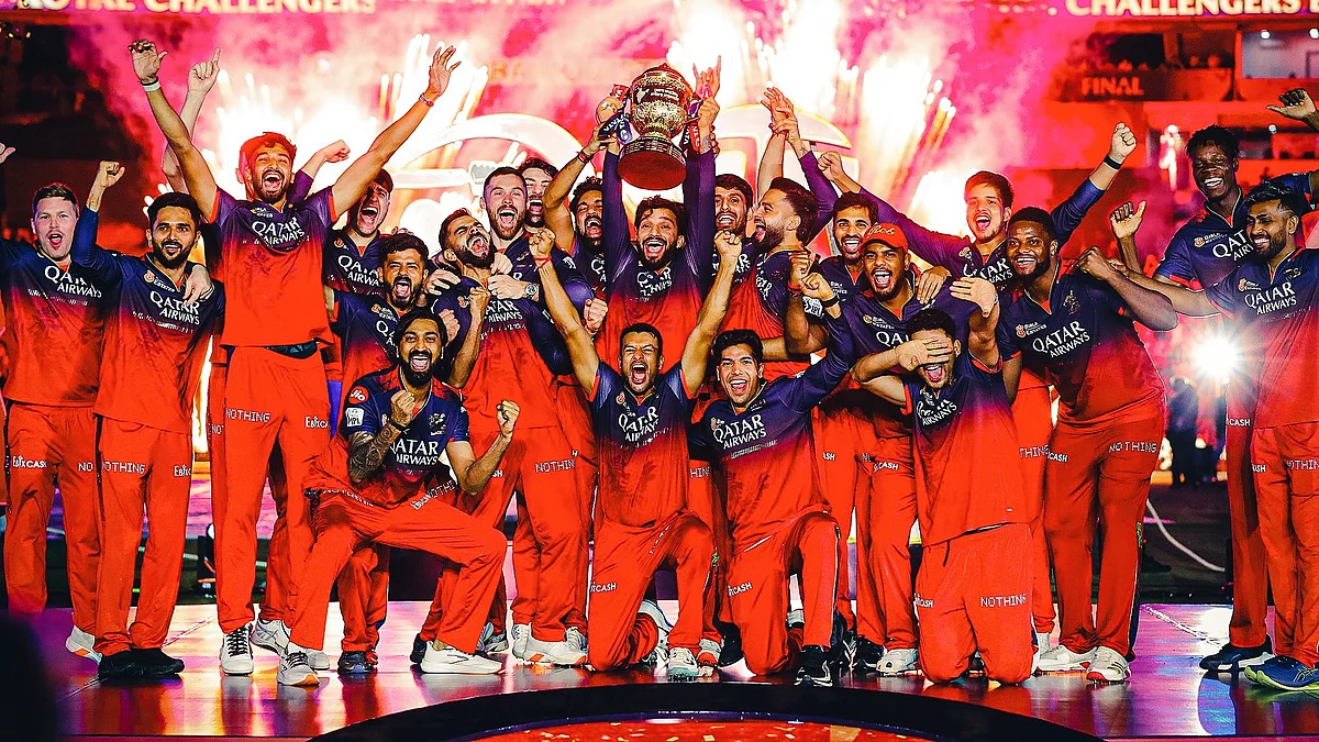 The victorious RCB team with the 2025 trophy
