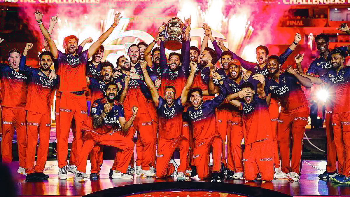 The victorious RCB team with the 2025 trophy