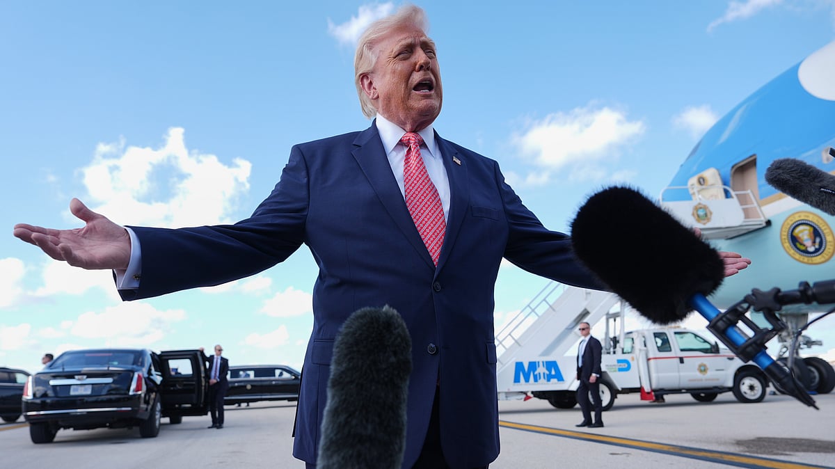Donald Trump speaks to reporters after stepping off Air Force One.
