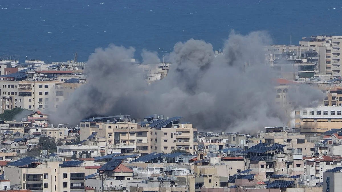 Smoke rises following an Israeli airstrike in Dahiyeh, Beirut's southern suburbs, 30 March