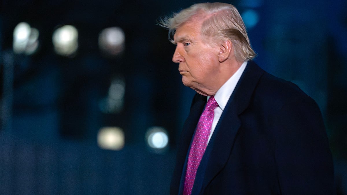 Donald Trump walks across the South Lawn upon arrival at the White House.