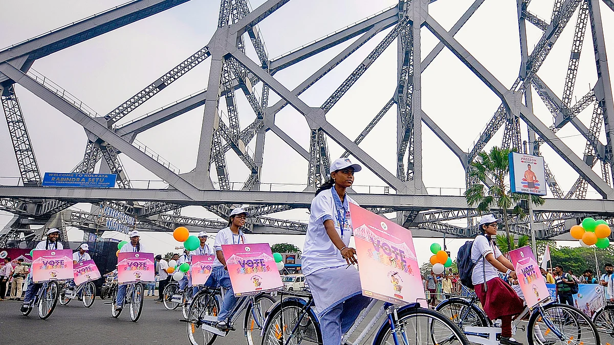 Students in a cycle rally on Kolkata's Howrah Bridge as part of a voter awareness campaign, 27 March