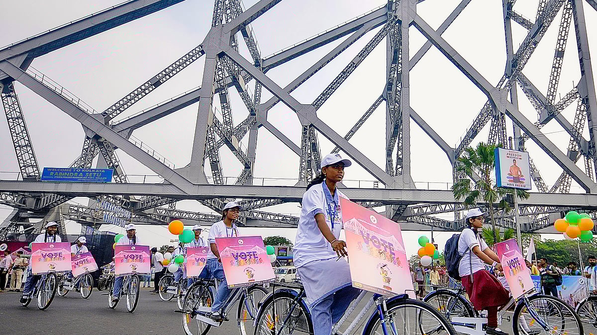 Students in a cycle rally on Kolkata's Howrah Bridge as part of a voter awareness campaign, 27 March