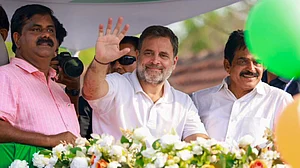 Rahul Gandhi greets supporters during a roadshow in Kozhikode.