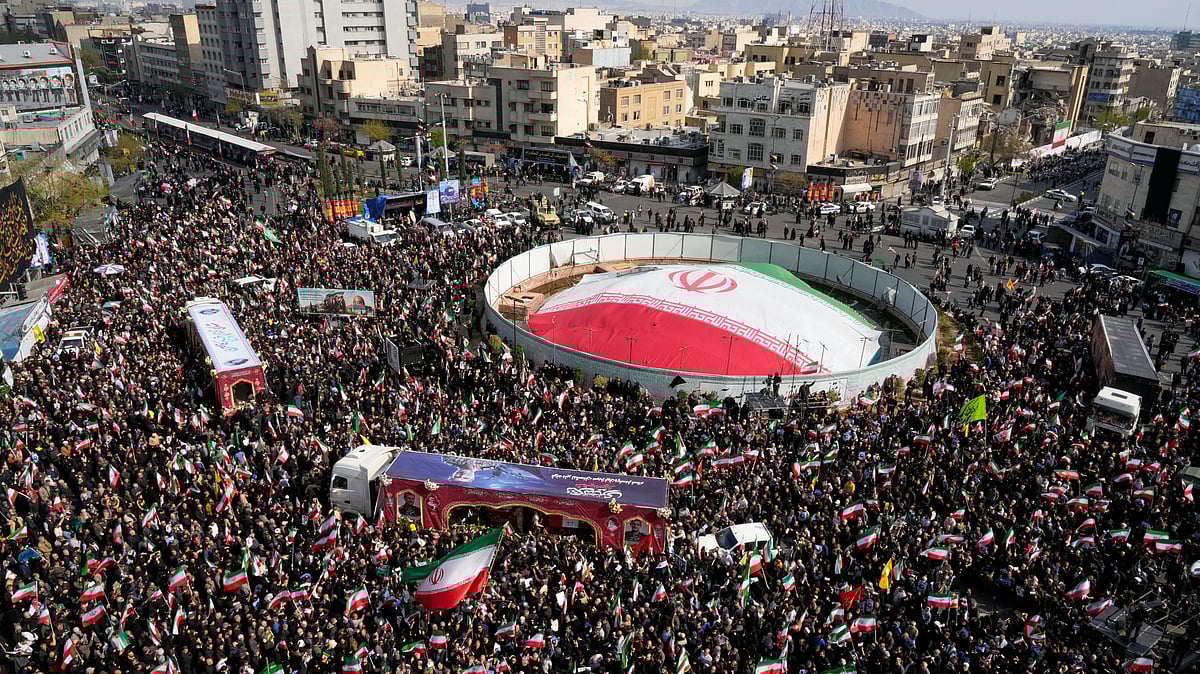 Mourners gather during a funeral procession in Tehran.