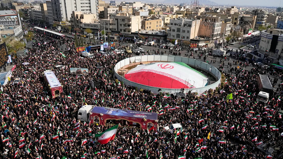 Mourners gather during a funeral procession in Tehran.