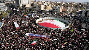 Mourners gather during a funeral procession in Tehran.