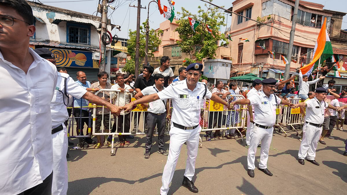 Police outside Mamata Banerjee's residence during a BJP roadshow for filing of nominations, Kolkata