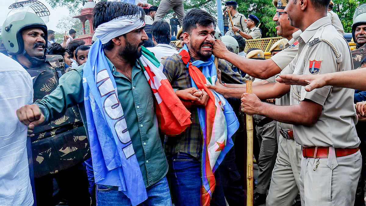 Police detain members of Congress students' wing NSUI at a protest in Jaipur, 3 April 