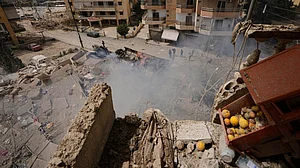 Smoke rises from a building destroyed in an Israeli airstrike in port city of Tyre, Lebanon.