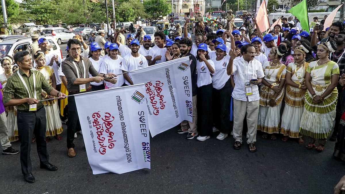 CEO Rathan U Kelkar flags off a voter awareness rally in Kerala.
