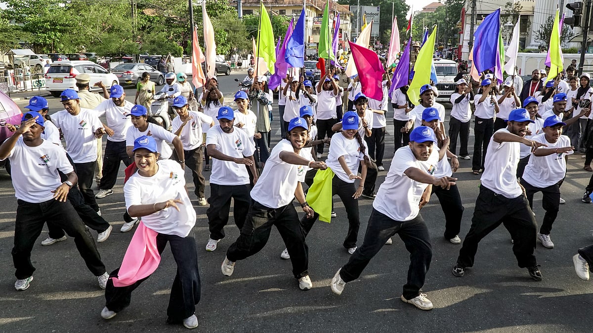 People participate in a voter awareness rally on the eve of Kerala assembly elections.