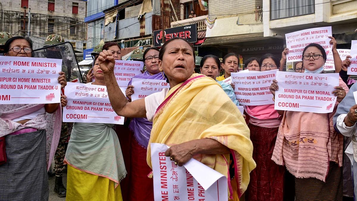 People stage a protest under the banner of Coordinating Committee on Manipur Integrity (COCOMI)