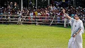 West Bengal Chief Minister Mamata Banerjee waves during a public meeting