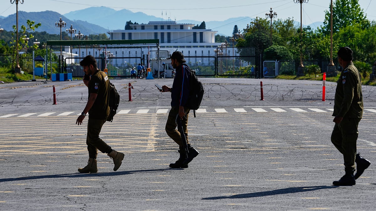 Security personnel take positions ahead of the talks in Islamabad