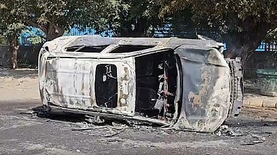 A vehicle set ablaze in Noida