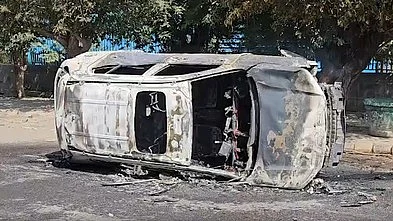 A vehicle set ablaze in Noida