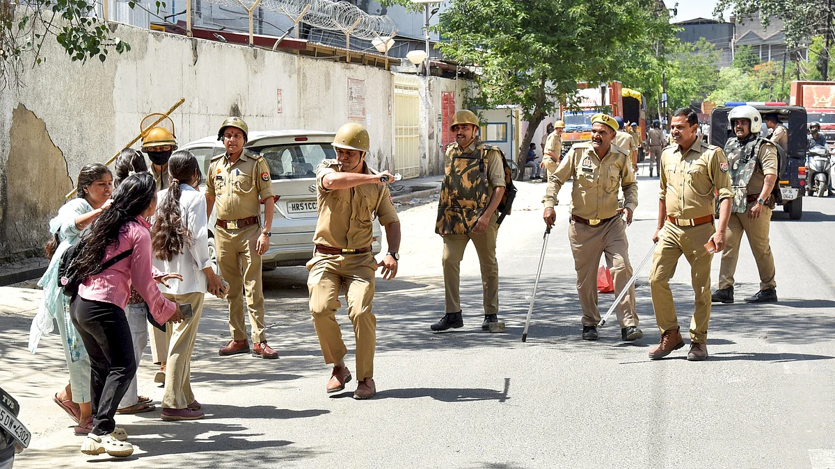 Police personnel resort to a lathi charge on protesters demanding a salary hike in Noida.