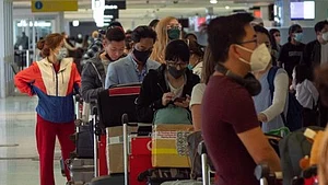 Airline passengers line up at an airport in Australia