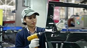 A women employee at Maruti Suzuki India Limited plant
