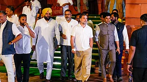 Rahul Gandhi and others leave after voting on the Constitution Amendment Bill, 17 April