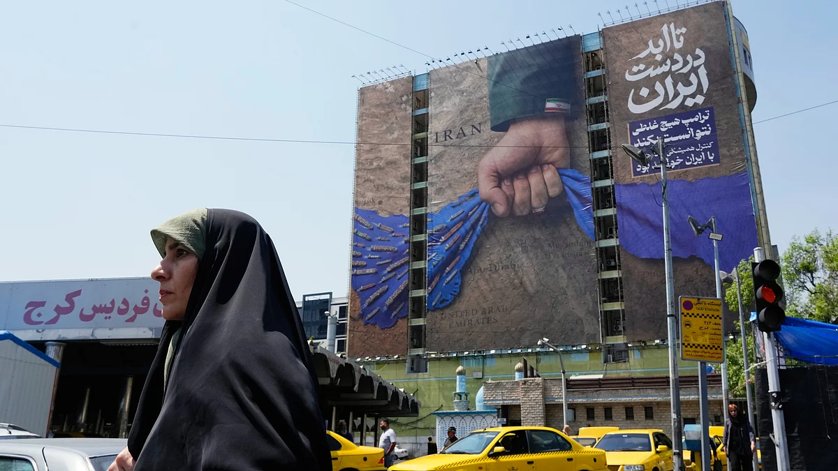 A Tehran billboard depicting a military personnel's hand holding the Strait of Hormuz
