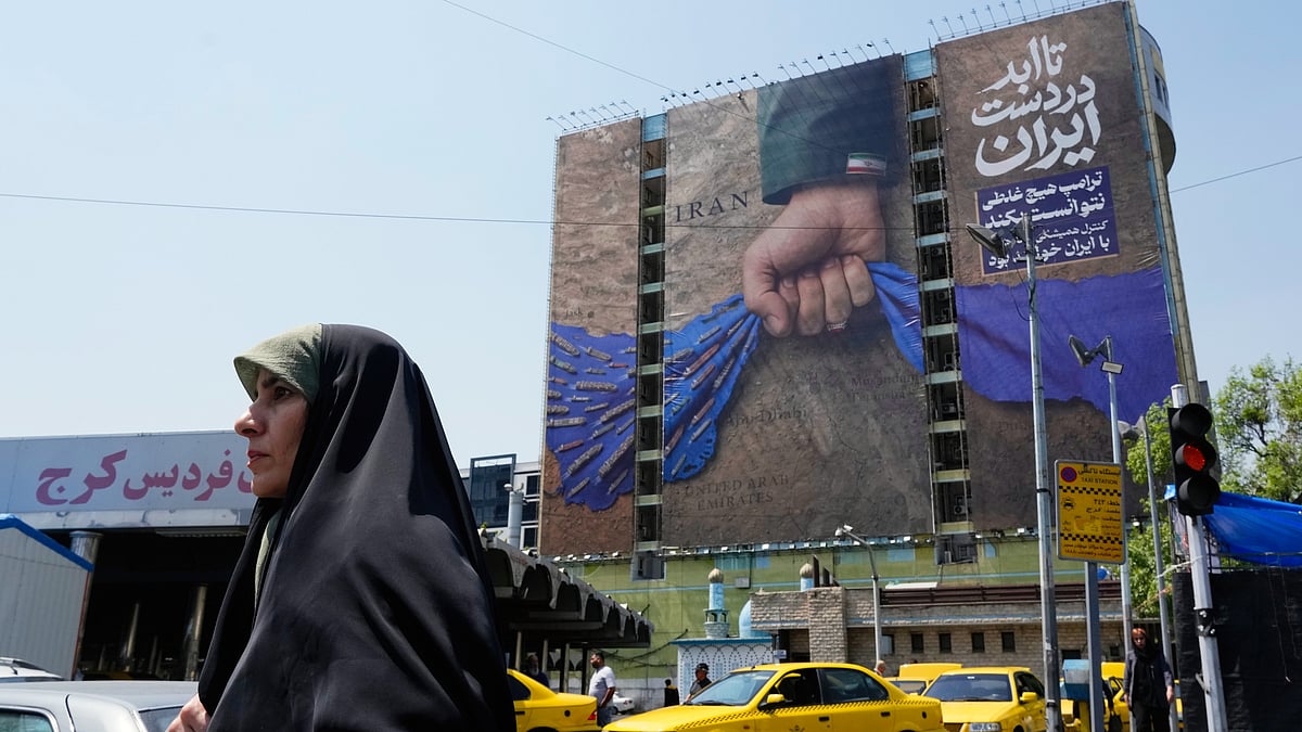 A Tehran billboard depicting a military personnel's hand holding the Strait of Hormuz