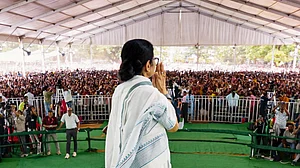 Mamata Banerjee greets a gathering at an election campaign meeting in Durgapur