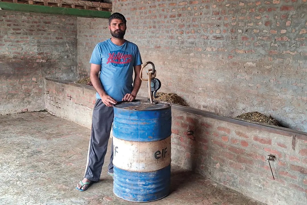Small farmer Lakhwinder Singh will have to borrow money to store several drums of diesel as harvest season nears