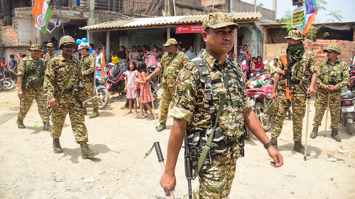 CAPF personnel conduct a route march ahead of assembly elections in Malda. 