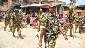 CAPF personnel conduct a route march ahead of assembly elections in Malda.