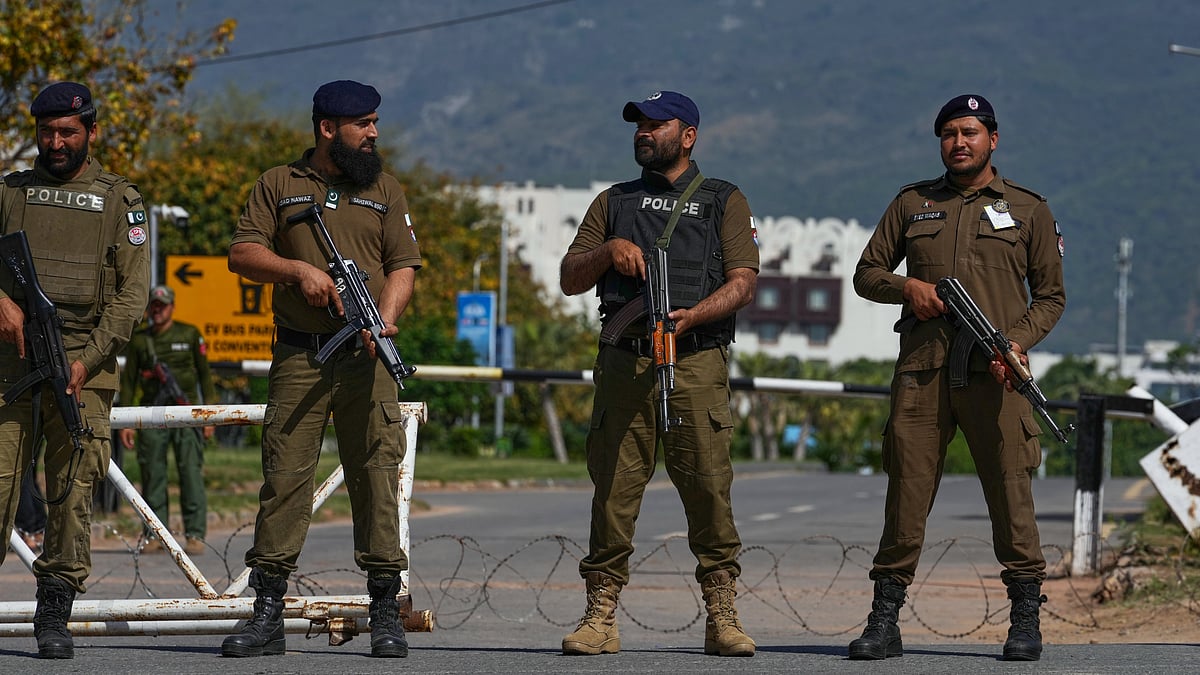 Police guard a checkpoint in Islamabad ahead of a possible second round of US–Iran talks.