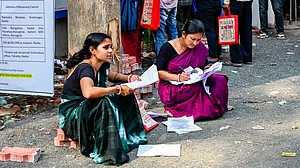 People wait to submit petitions before a tribunal in Ranaghat, Nadia district, 20 April 20