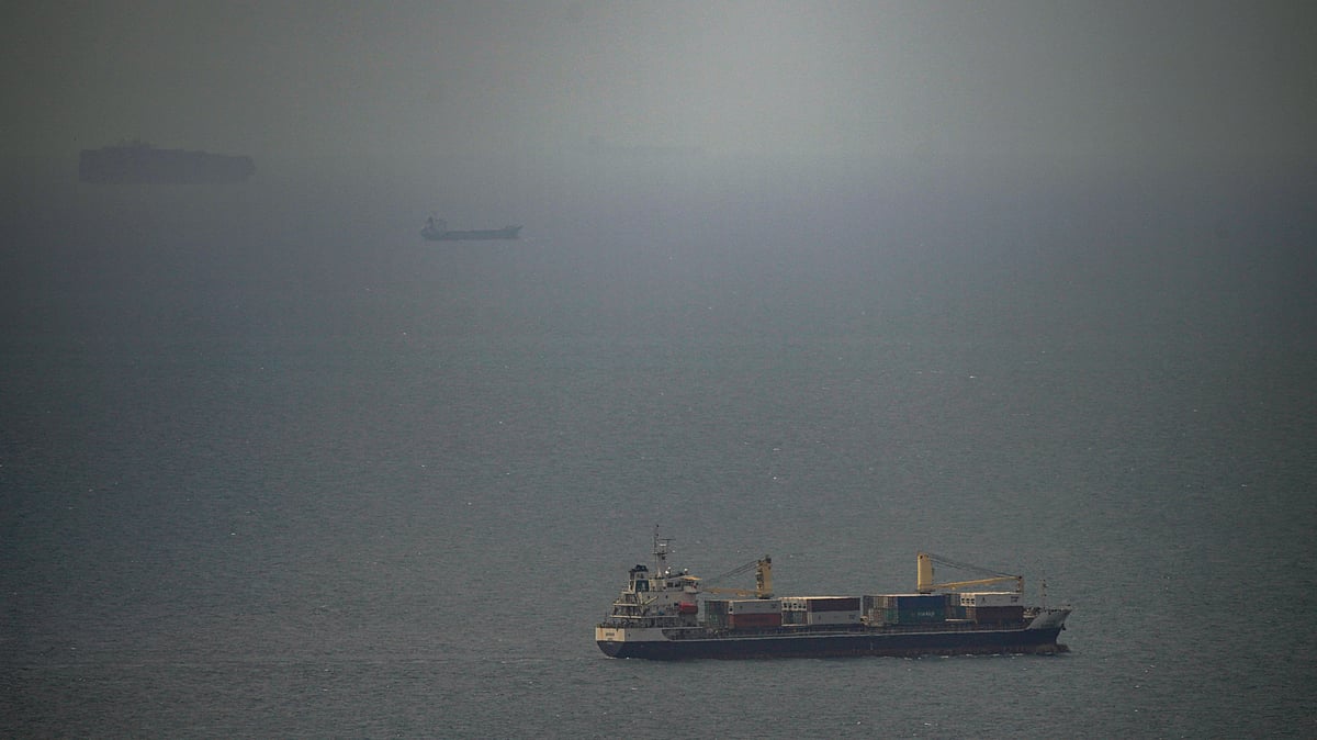 A cargo ship sails in the Persian Gulf toward the Strait of Hormuz, 22 April