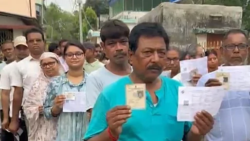 Voters line up at a polling station in West Bengal on Wednesday, 23 April